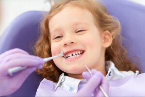 smiling-little-girl-dental-checkup